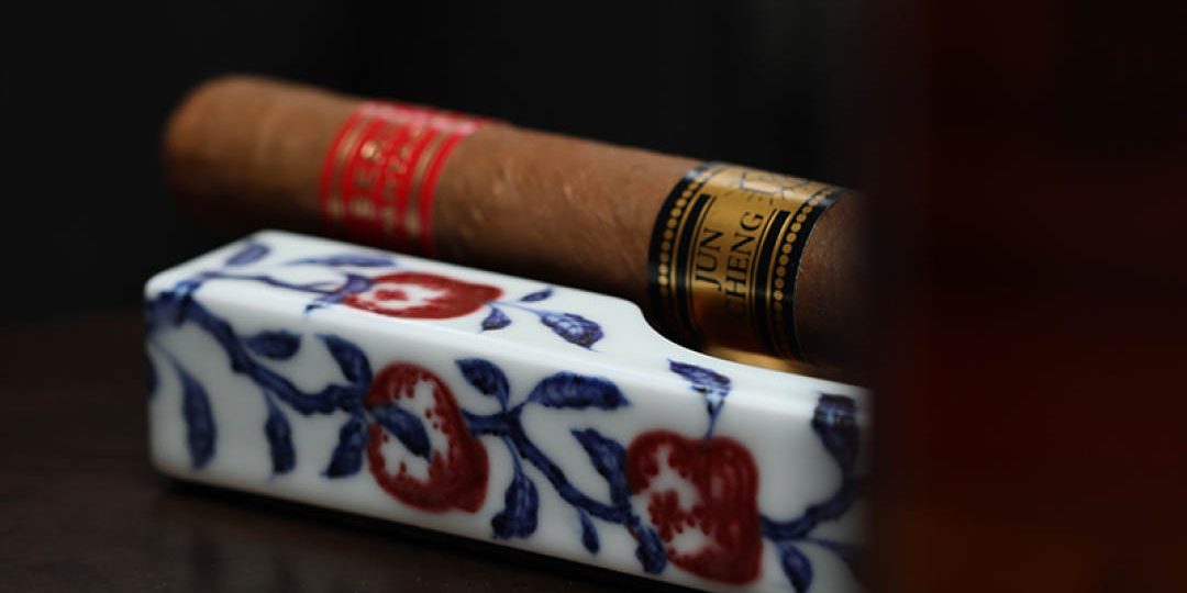 Ancient-inspired-blue-and-white-underglaze-red-peach-shaped-cigar-ashtray-3.jpeg