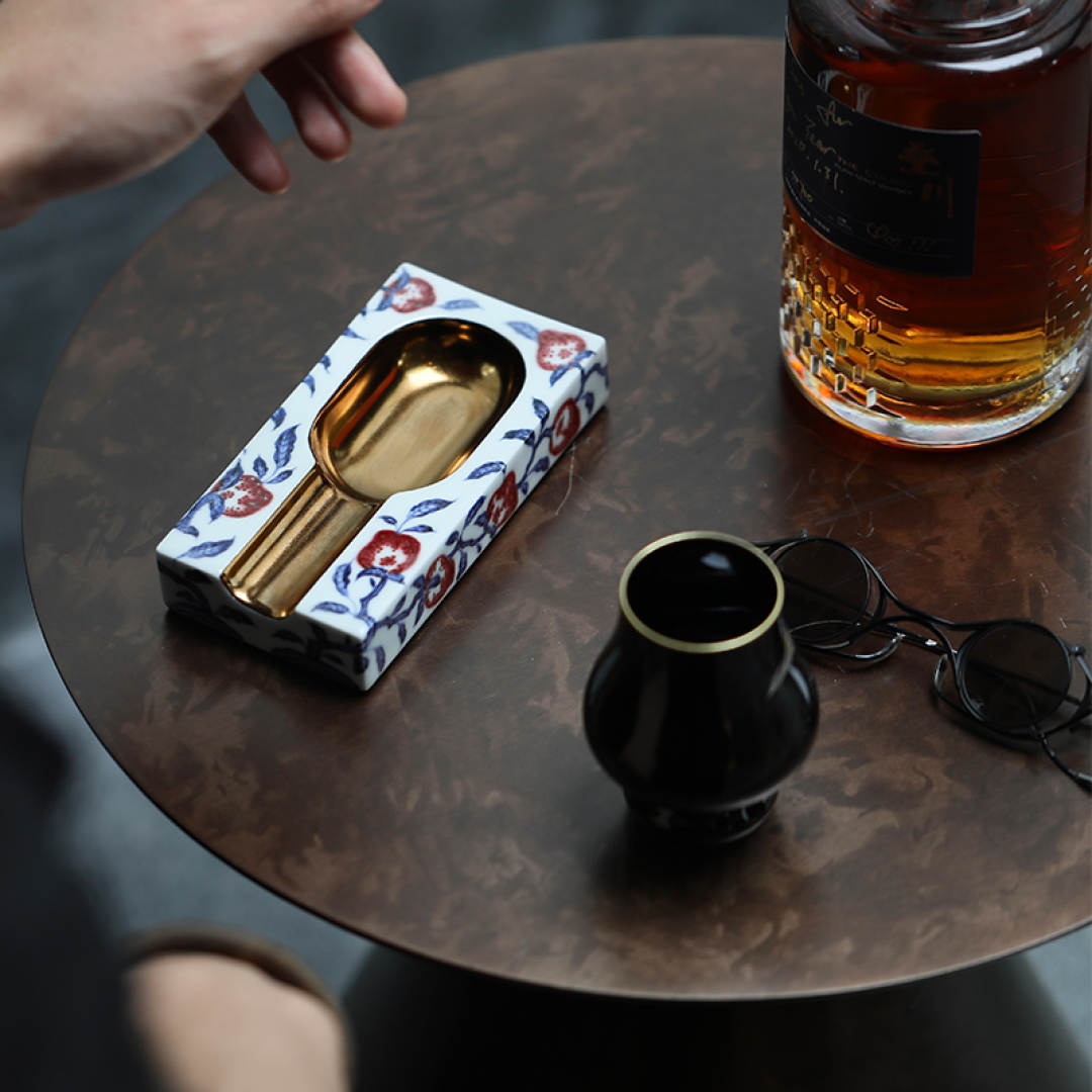 Ancient-inspired blue and white underglaze red peach-shaped cigar ashtray