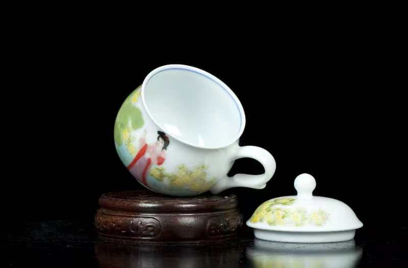 Hand-painted coffee cup with ancient ladies.